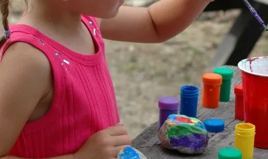 kid painting rocks 