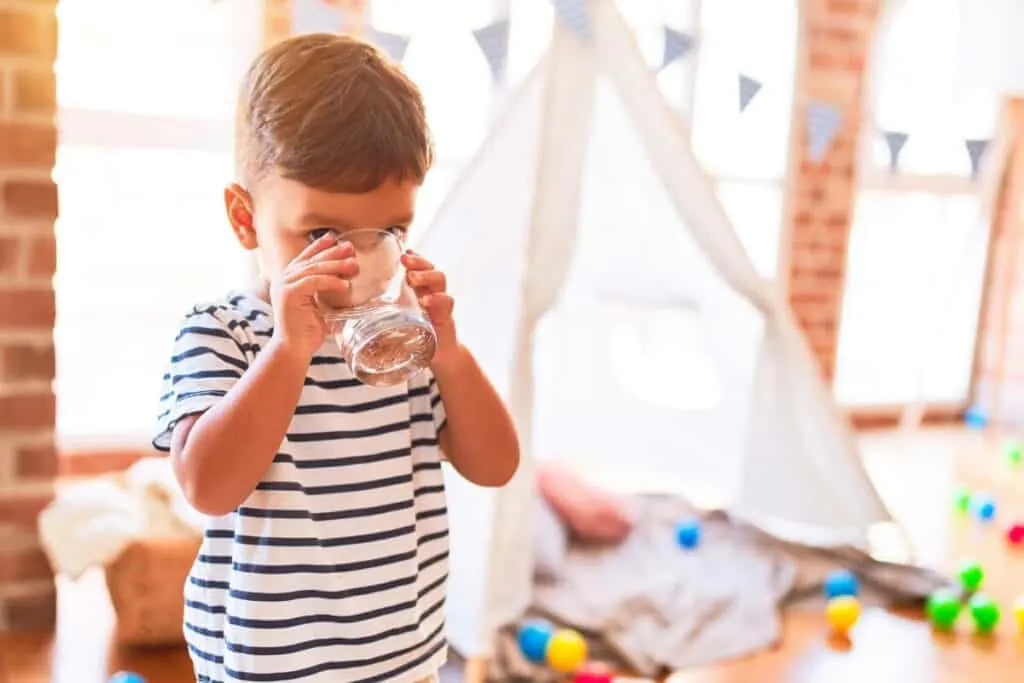 young child drinking water